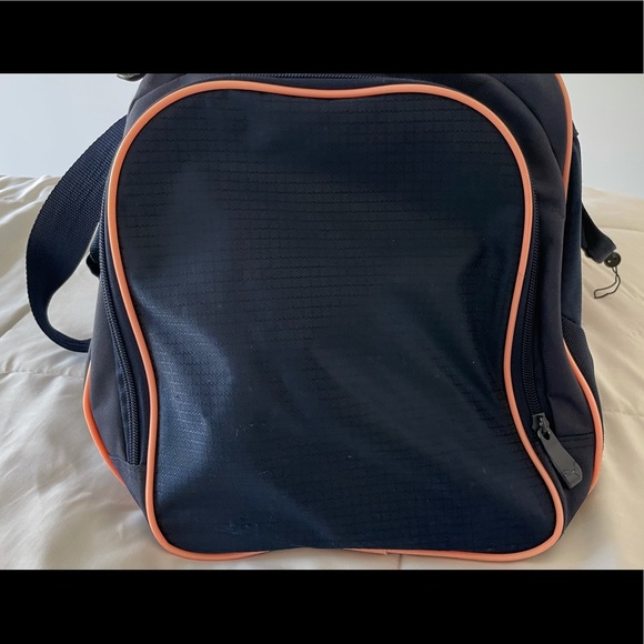 A navy blue and baby pink Puma duffel bag. - Picture 4 of 7